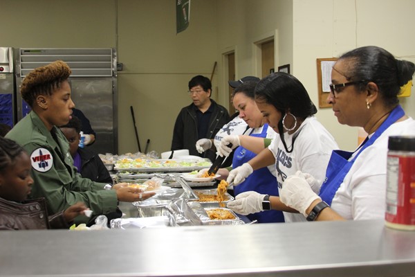 Parents serve others at PASTA NIGHT.